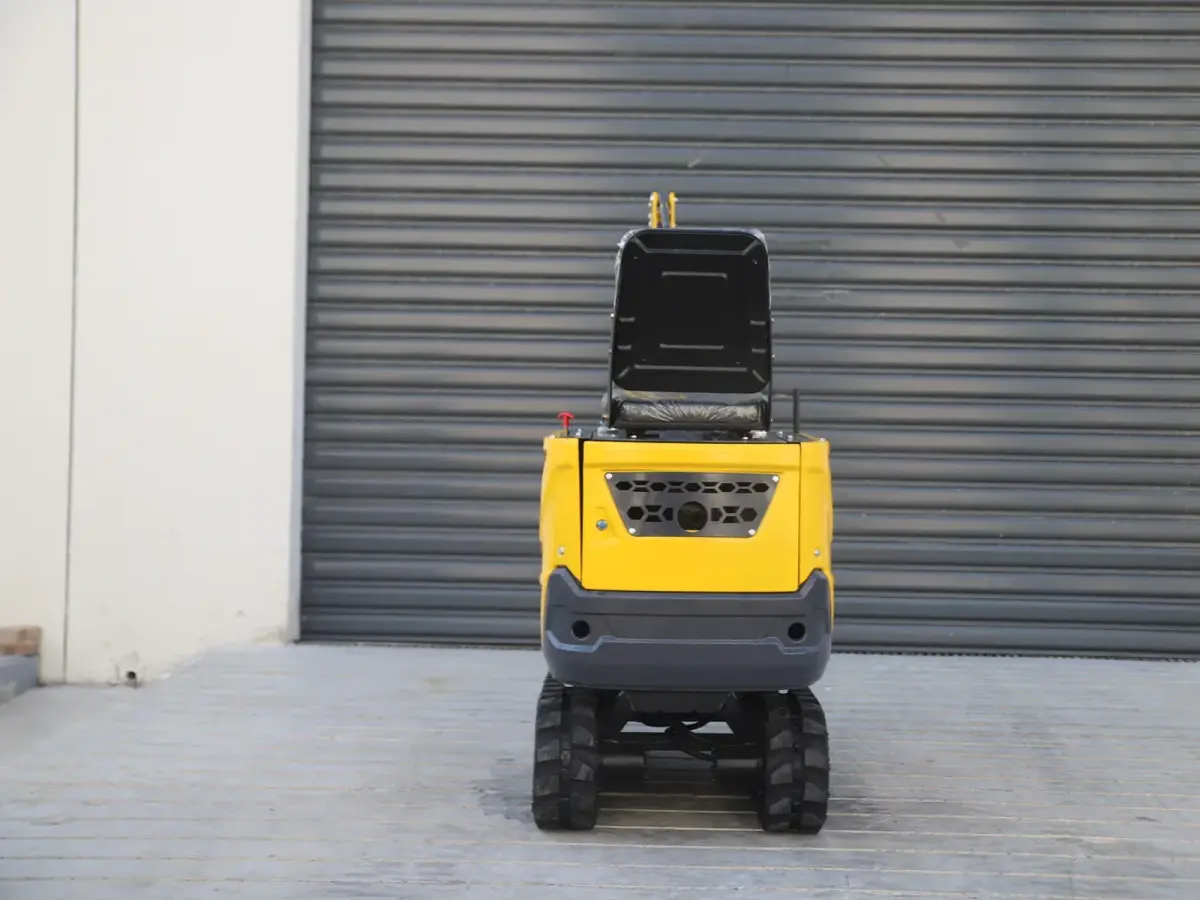 06Q mini excavator rear view showing compact counterweight body and narrow track stance