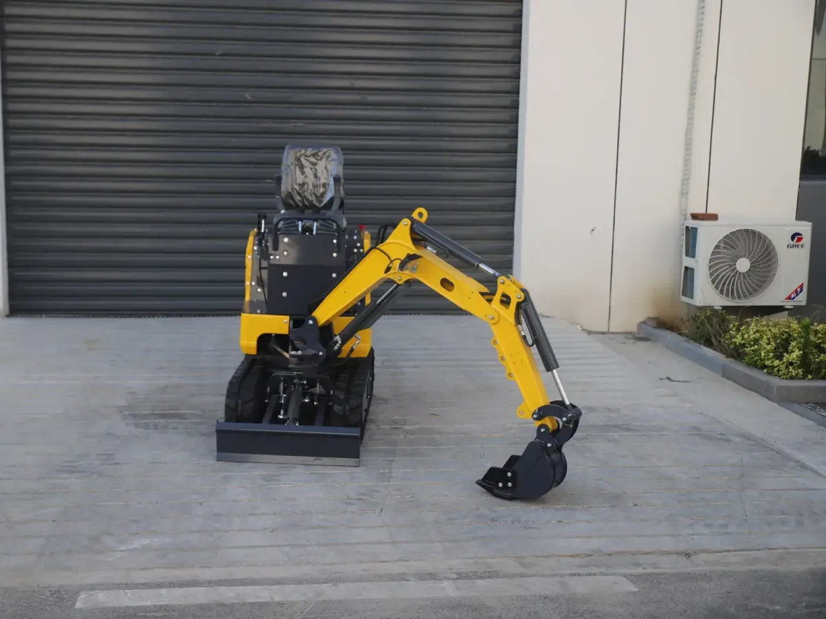 06Q mini excavator front view in working stance with arm extended and bucket lowered