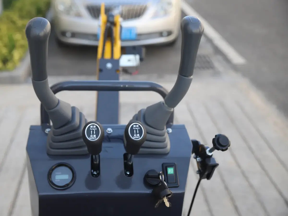 06Q mini excavator operator control console close-up with joysticks and key switch