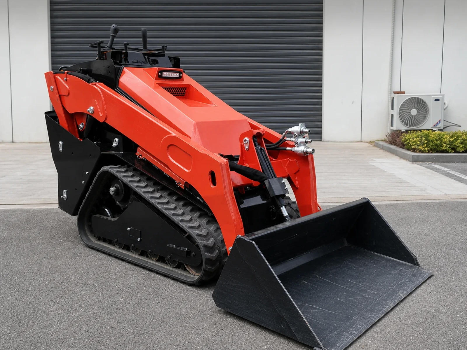 Compact track loader with larger contractor-grade profile and raised loading arms